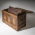 Baroque chest from the early 18th century, crafted from oak. The front is richly carved with decorative motifs and...