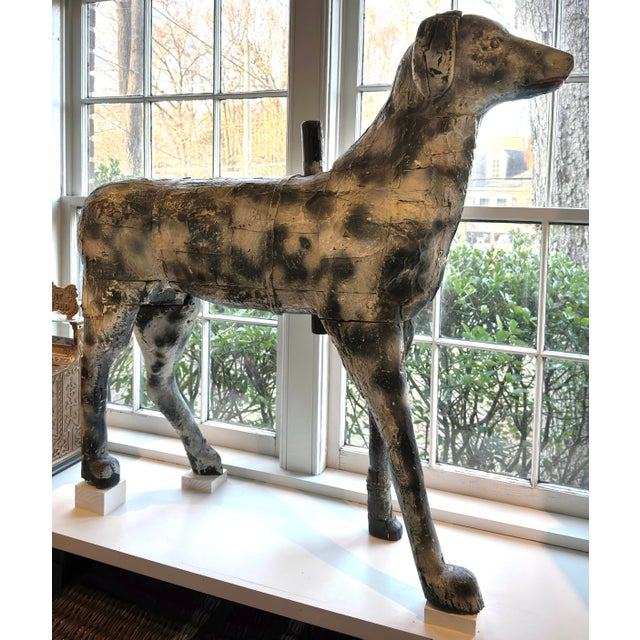A very scarce antique hand carved and painted primitive French carousel dog. It is extremely rare that a dog was part of...