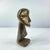 A hand-carved Lega figure originates from the Lega people in the Democratic Republic of the Congo. The figure is easily...