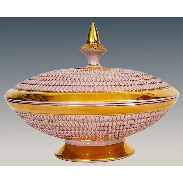 Offering a stunning New Old Stock pink and metallic gold porcelain covered dish in the style of Aldo Londi "seta" series,...