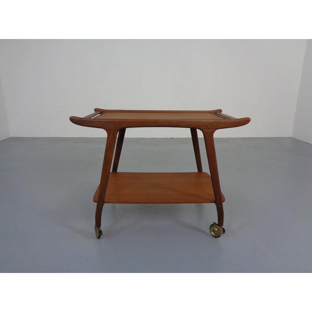 Rolling tea or serving trolley in teak from the 1960s.