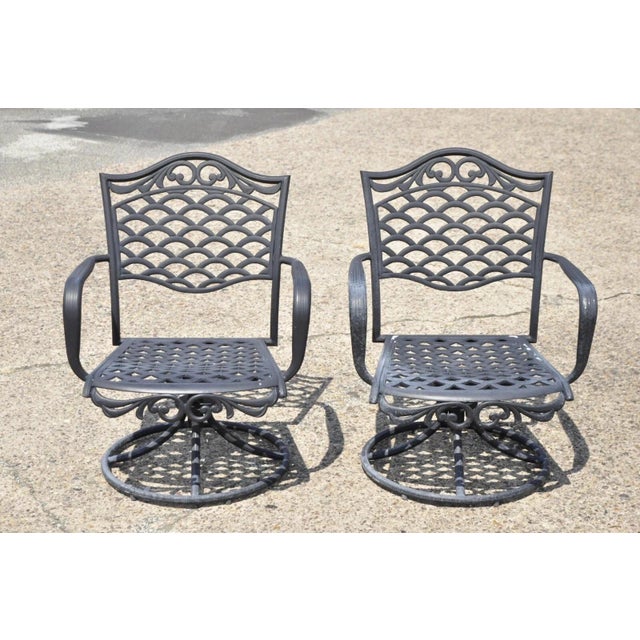 Contemporary Mediterranean Style Aluminum Swivel and Tilt Black Tuscan Garden Patio Armchairs - a Pair. Circa Late 20th...