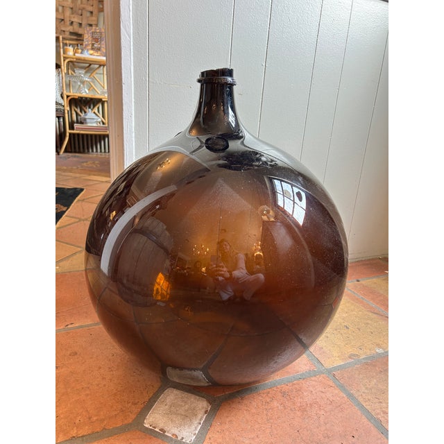 Antique 19th Century French Blown Glass Demijohn Bottle. Globular form amber demijohn bottle with air bubbles typical of...