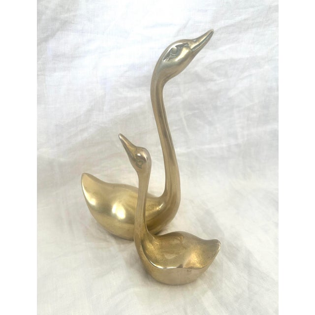 MCM brass pair of swans. Great for a centerpiece, paperweights or decor on a shelf. I have more in my other listings...