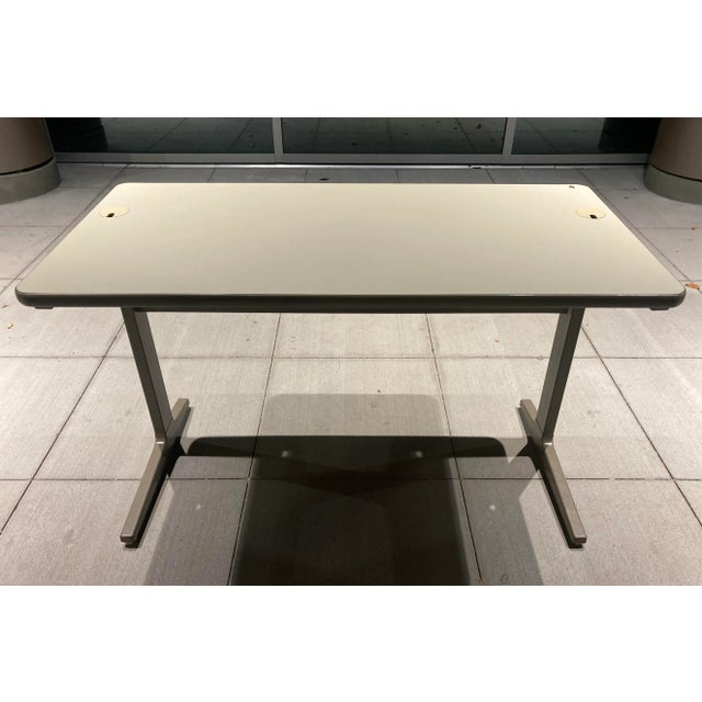 Vintage action office table or desk design by Jack Kelley and Robert Propst, with steel base, off-white melamine top,...