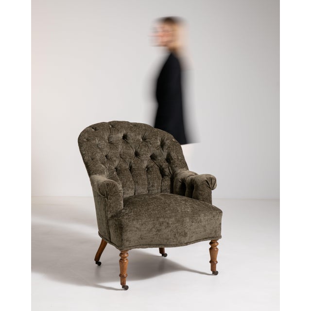 A classic Napoleon III armchair featuring generous upholstery and a balanced, elegant frame. The design reflects comfort...