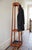 An elegant and well preserved mid century coat and umbrella stand in solid mahogany. This striking hall stand features its...