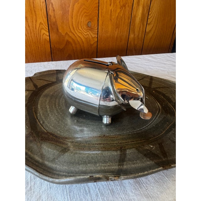 Chrome plated metal elephant coin bank. Ideal for study, kids room, vignettes. Stamped Napier