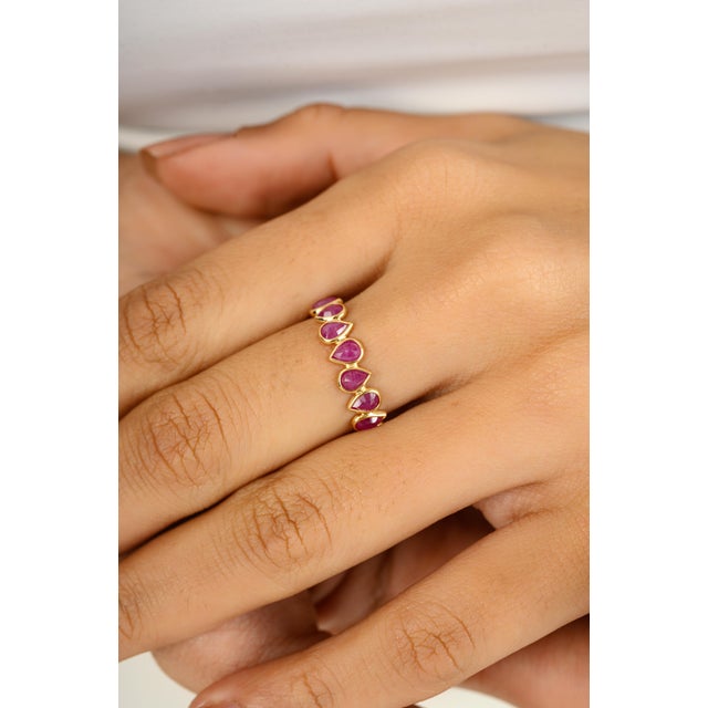 Handmade 18k Yellow Gold Pear Cut Natural Ruby Stackable Eternity Band Ring symbolizes the everlasting love between a...
