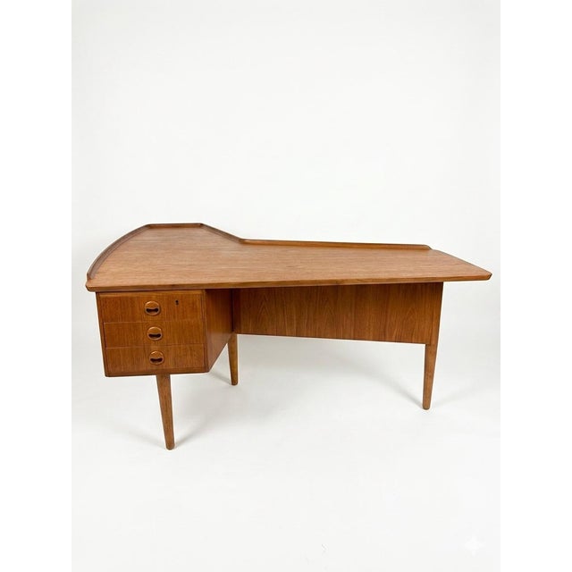 Rare late 1950's/early 60's era Scandinavian teak desk. Unmarked but attributed to Arne Hovmand-Olsen. Features built-in...