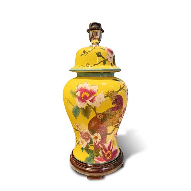 Colorful vase lamp is delightful with the bird and floral pattern. The multiple colors are sharp on a walnut base with a...
