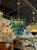 Modern Murano "saddle" glass waterfall chandelier in green.