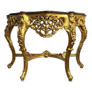 Carved Gilt Wooden Console Table with Shaped Marble Top For Sale