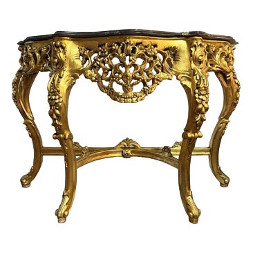 Carved Gilt Wooden Console Table with Shaped Marble Top For Sale
