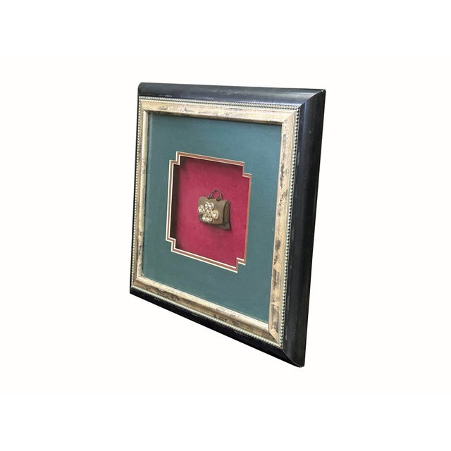 This vintage Oriental Tibetan-style flint pouch display is adorned with white and silver-colored beads arranged in an...