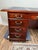 A stately vintage mahogany executive desk by Kimball, a maker long associated with fine American office furnishings. This...