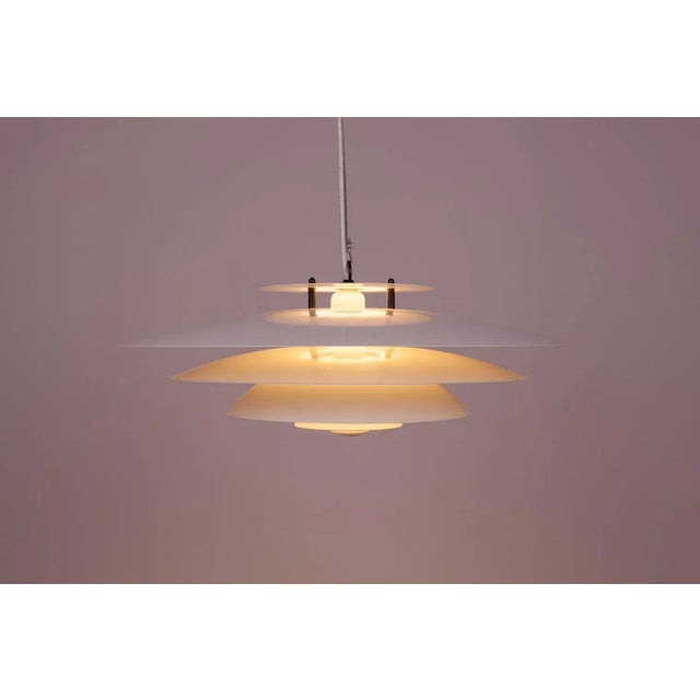 This pendant lamp was designed by Jurgen Buchwald for Laterna Danica range produced by Nordlux, Denmark in the 1970s. The...
