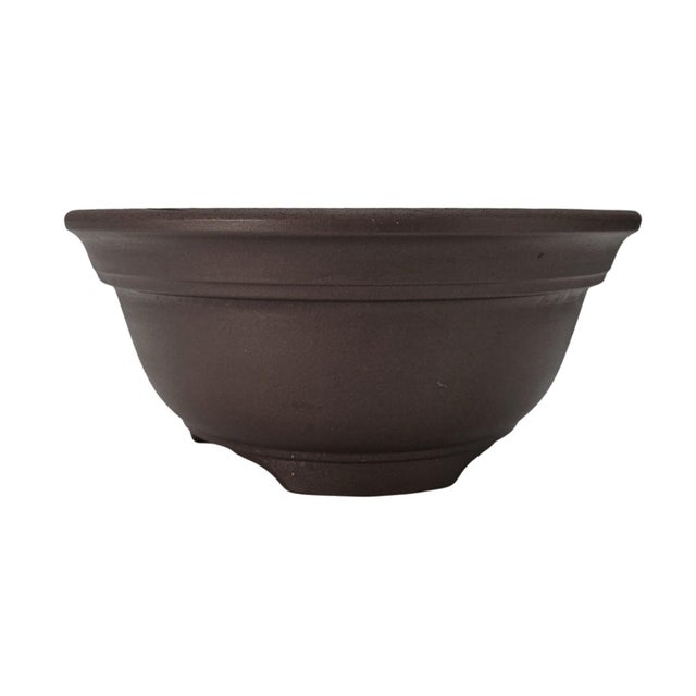 Japanese bonsai pot of round cascade or semi-cascade form, executed in unglazed brown stoneware bonsai clay. The pot...