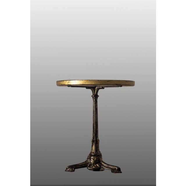 Assembled bistro table, base circa 1900 and ceramic tabletop from the 1970s Bistro table consisting of an antique cast-...