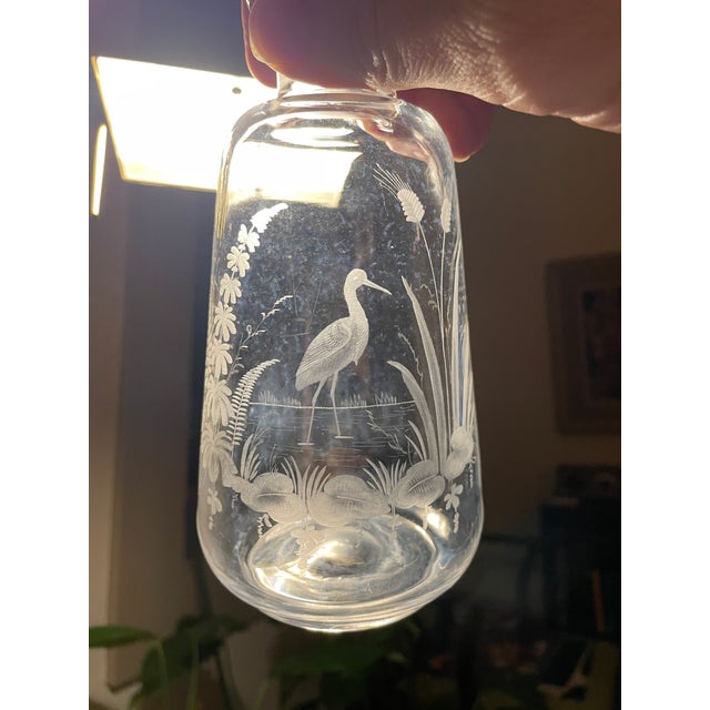 Antique glass bottle with a silver covered stopper. It probably started as a decanter or scent bottle but would make a...