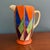 A striking Clarice Cliff Original Bizarre Athens jug dating to circa 1929, featuring a bold geometric design in vivid...
