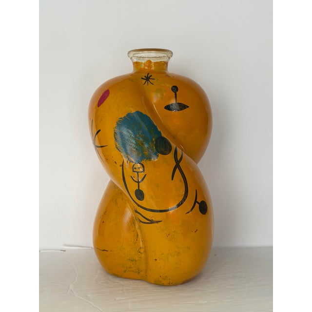 We are very pleased to offer this sculptural hand-blown art glass vase, circa 1980s–1990s. Rendered in a rich amber-honey...