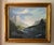 Vintage oil painting of a Rocky Mountain landscape in ornate gold frame. Signed to the lower right corner Lockwood....