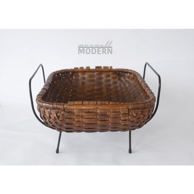 Beautiful rare mid century modern magazine basket/catch all with woven chestnut wood and a supporting black metal frame...
