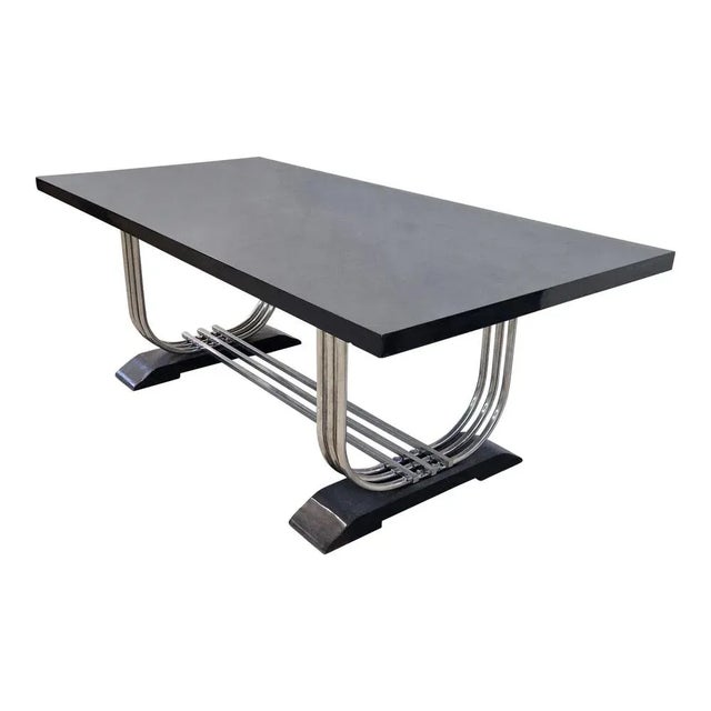 Dining table/Conference of Art Deco line. The plane and the two basic elements are in glossy black lacquered wood; The...