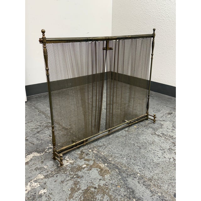 Design Plus Gallery presents a Vintage Brass Fireplace Screen. The screen features double mesh curtain panels, turned...