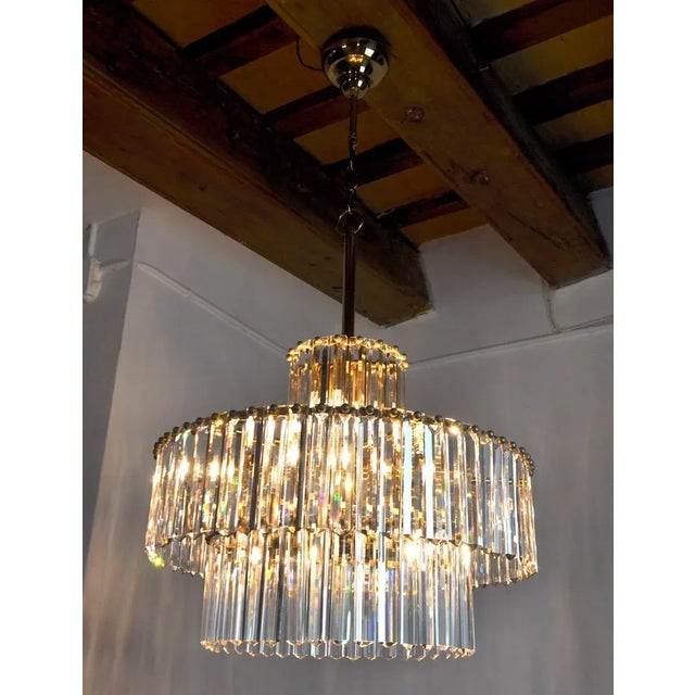 Super and rare Kinkeldey chandelier designated and produced in Germany in the 70s. Golden brass structure consisting of...