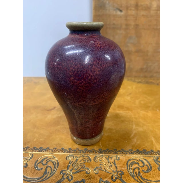 19th Century Petite Sang De Boeuf or Flambé Deep Purple Baluster Vase. Sang de boeuf, (French: “oxblood”) also called...