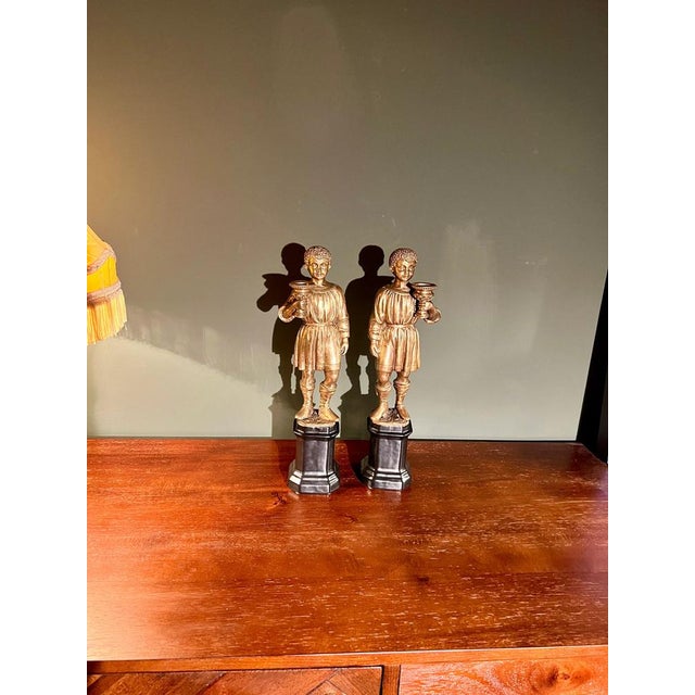 Youth Candlesticks in Brass on Black Porcelain Bases, 1920s, Set of 2, in Flawless conditions. Designed 1920 to 1949 This...