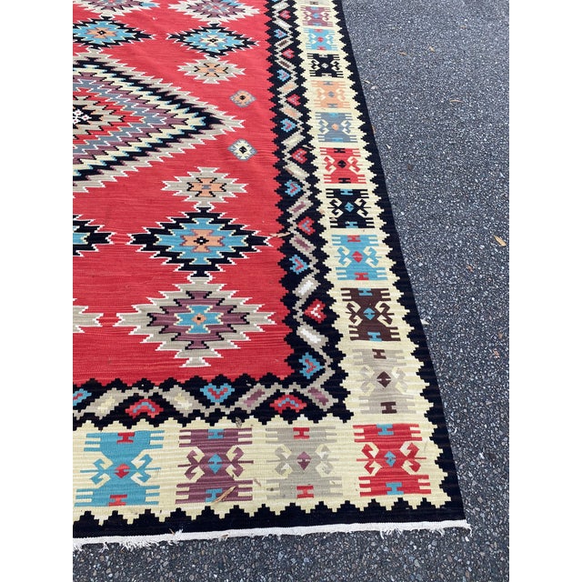 This is a flat weave Kilim. It’s on the vintage side as it has a cotton foundation, antique pieces generally are all wool,...