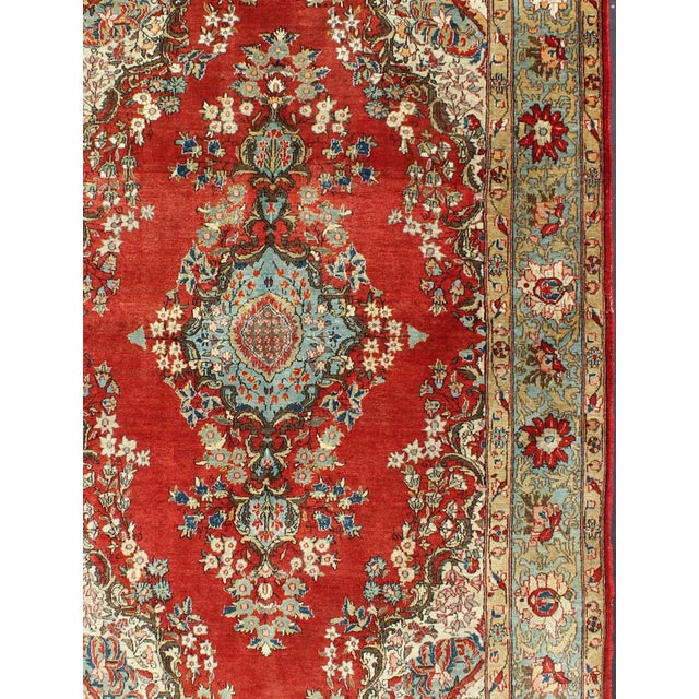 Keivan Woven Arts, , kwarugs. This beautiful vintage Qum rug bears a stretched central Medallion of blue with an...