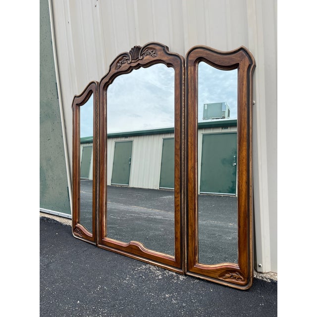 A Tri-fold dressing mirror from Drexel Heritage’s iconic Brittany Collection. Features the consistent carved reliefs and...