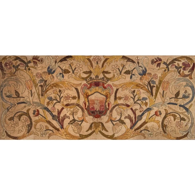 Hand-embroidered in wool and linen, this 3x6 framed antique English crewelwork panel dates to circa 1700. A fine example...