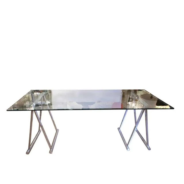 Italian 1970s writing/dining trestle table, glass top with two chrome bases. Conditions: very good. Measurements: Height:...