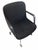 A pair of vintage Steelcase executive swivel chairs with black upholstery, integrated arms, and aluminum four-star caster...