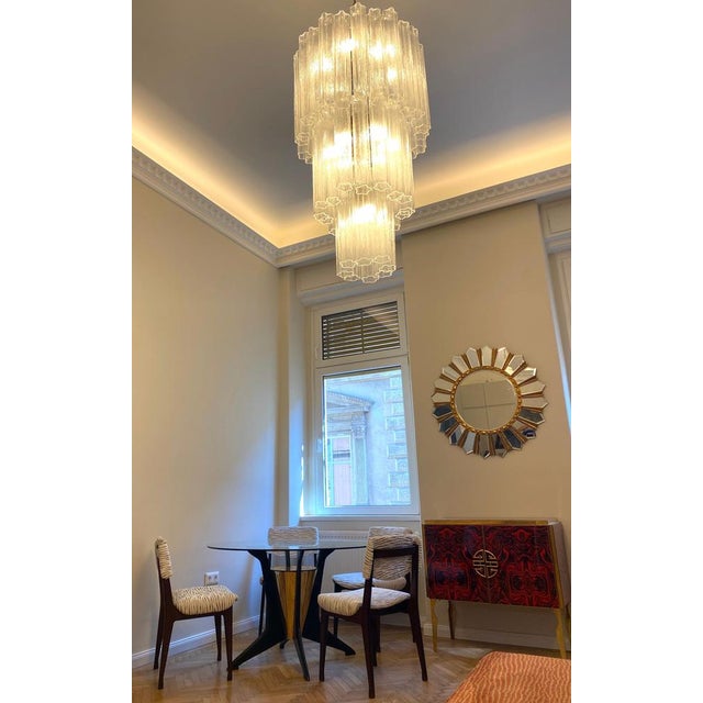 Amazing Chandelier with precious 48 tronchi Murano glass 40 cm long. Measures: Diameter 60 cm, height 110 cm. 16 lights....