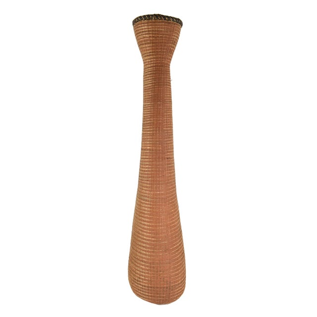 In Rwanda and neighboring Burundi, woven basketry receptacles and architectural elements constituted the most widespread...