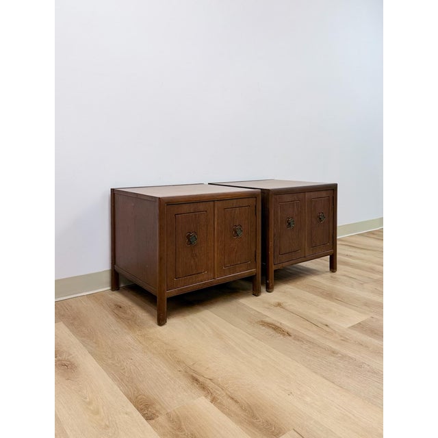This pair of vintage end tables by Mersman showcases the distinctive clover-shaped silhouette the brand became known for,...