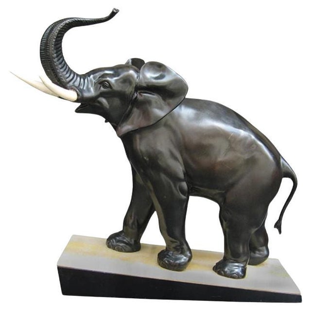A superb Irénée Rochard Art Nouveau period African elephant sculpture from France circa 1920. Patinated bronze on an onyx...