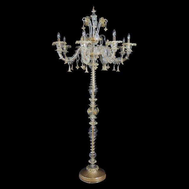 Floor lamp in transparent and white Murano glass, forged with ancient lace workmanship and with decorative elements in 24k...