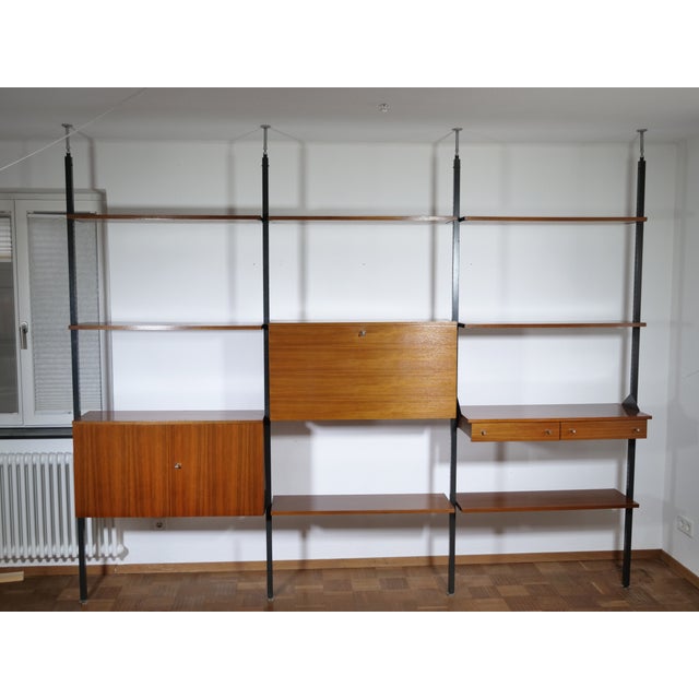 Simple teak shelving system from Italy, dating from the 1960s. Flexible modular system with three storage units, several...