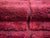 Rich, velvety, and unmistakably luxurious. This hand-knotted Moroccan wool rug features a striking grid of deep, velvet-...