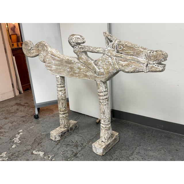 Design Plus Gallery presents a Vintage Hand-Carved Solid Wood Horse and Rider Sculpture, circa 2004. This large-scale...