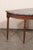 A beautifully carved French demi-lune wood table with marble top from the early 19th century. This antique console table...