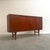 Remarks: Bruno Hansen sideboard / highboard designed by Henning Kjærnulf, Denmark 1960s. Outside teak veneer and inside...