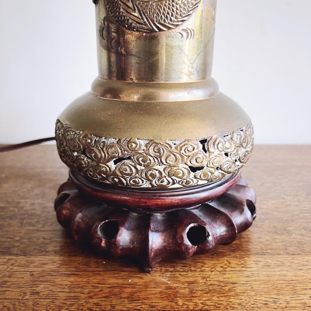 A gorgeous 1960s era Hong Kong made lamp with a brass base with dragon motifs. It is marked Hong Kong on the base. It is...